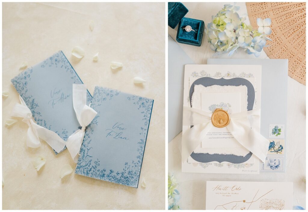 blue his and her vow books on an ivory styling mat at Hewitt Oaks wedding venue