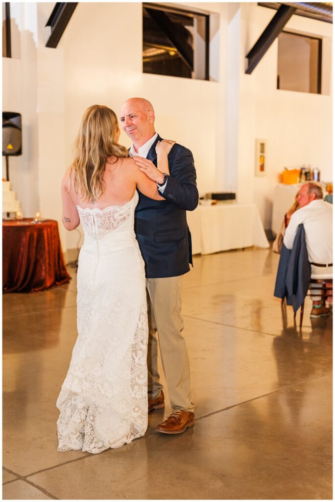 bride dancing with her dad inside at wedding reception at Gold Canyon resort venue