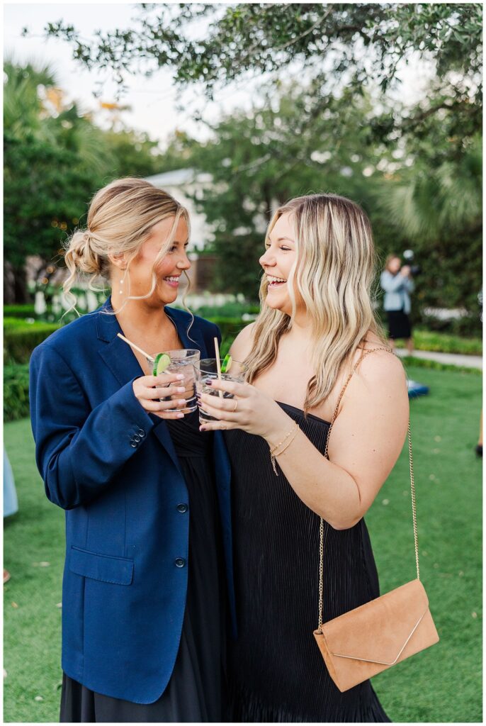 guests mingling and talking during cocktail hour outside at Wrightsville Manor