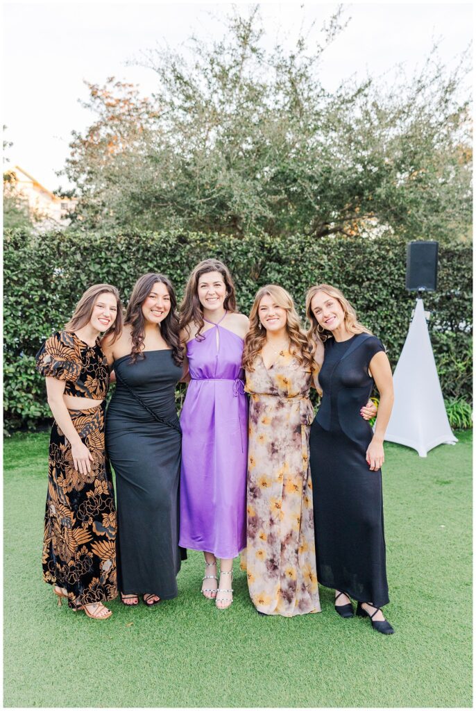 guests posing together during cocktail hour outside at Wrightsville Manor