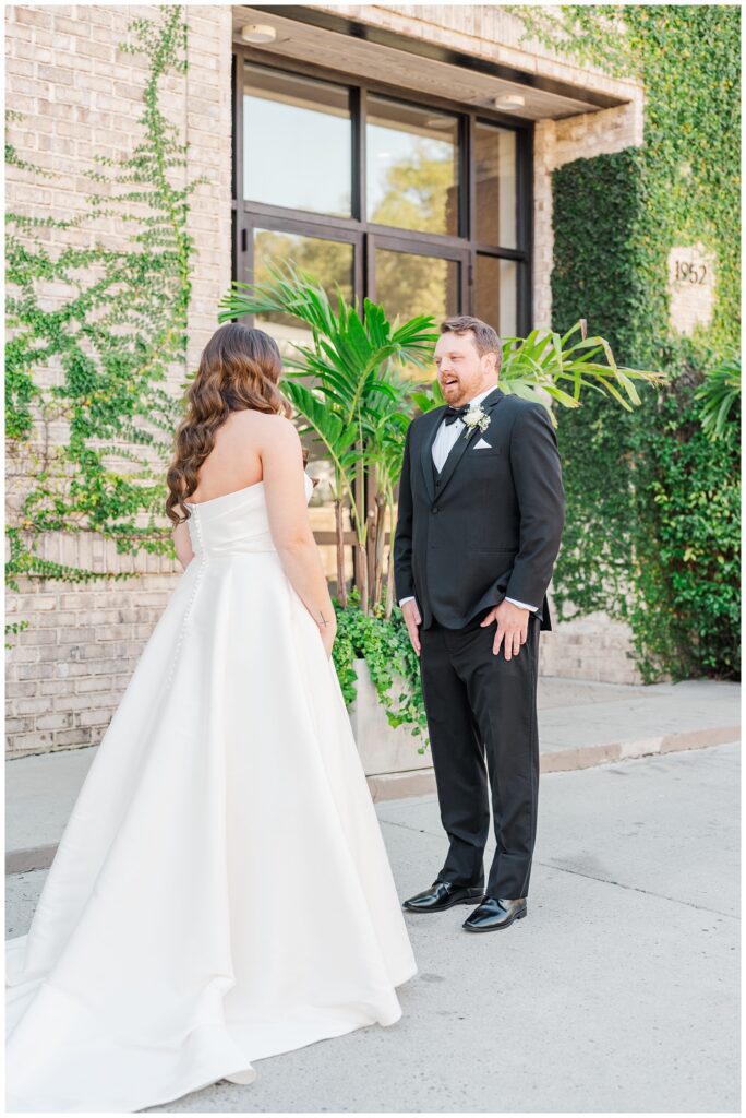 first look between the bride and groom outside the Wrightsville Manor wedding venue