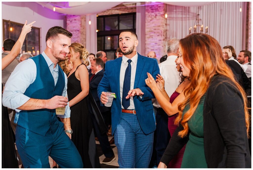 wedding guests dancing during reception at Wrightsville Manor