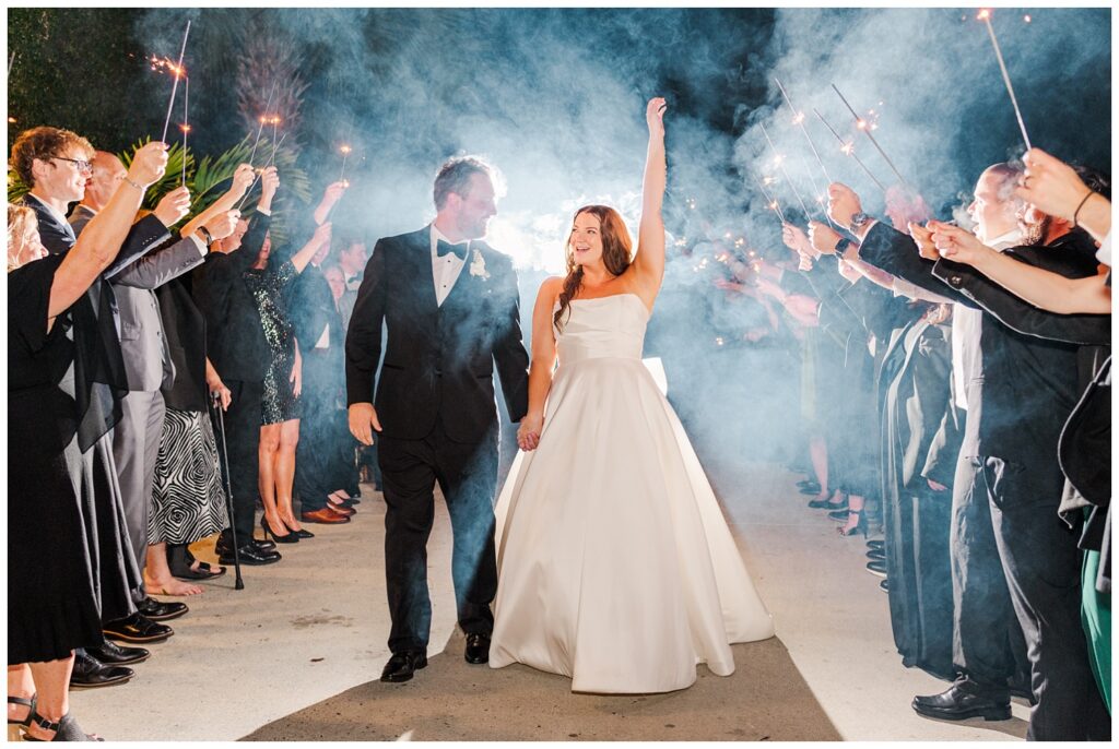 wedding couple walking out to sparkler exit at the end of the night in Wilmington, N.C.