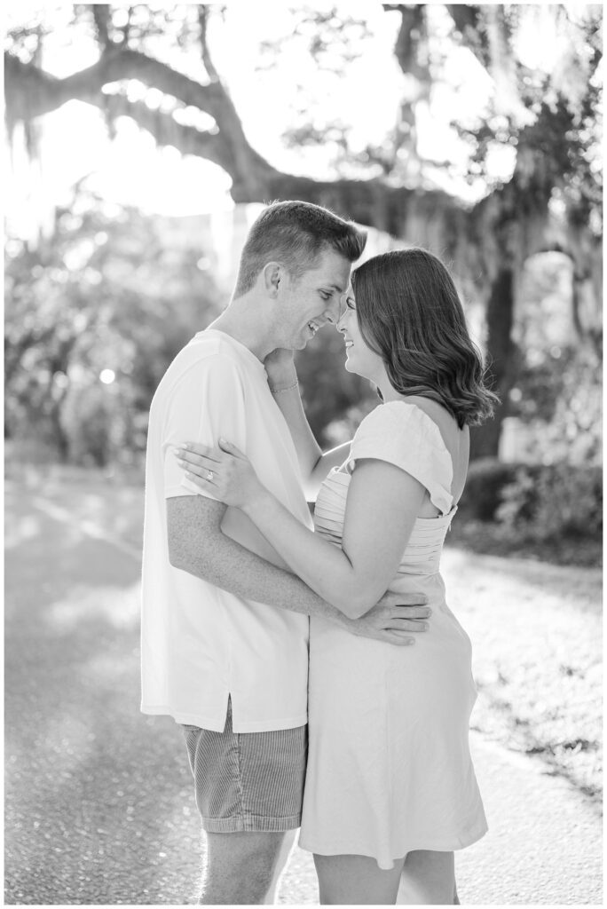 Wilmington engagement photographer with couple under a live oak tree 