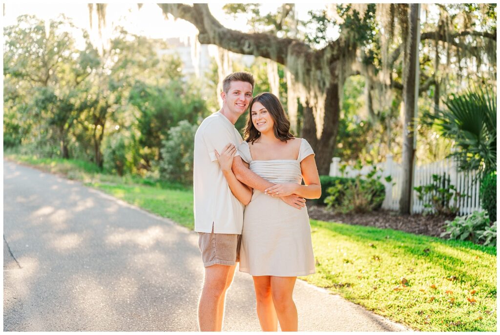 engaged couple hugging on the road during Wilmington portrait session