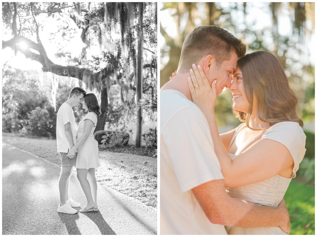 girl holding her fiance's face and smiling at Wilmington engagement session